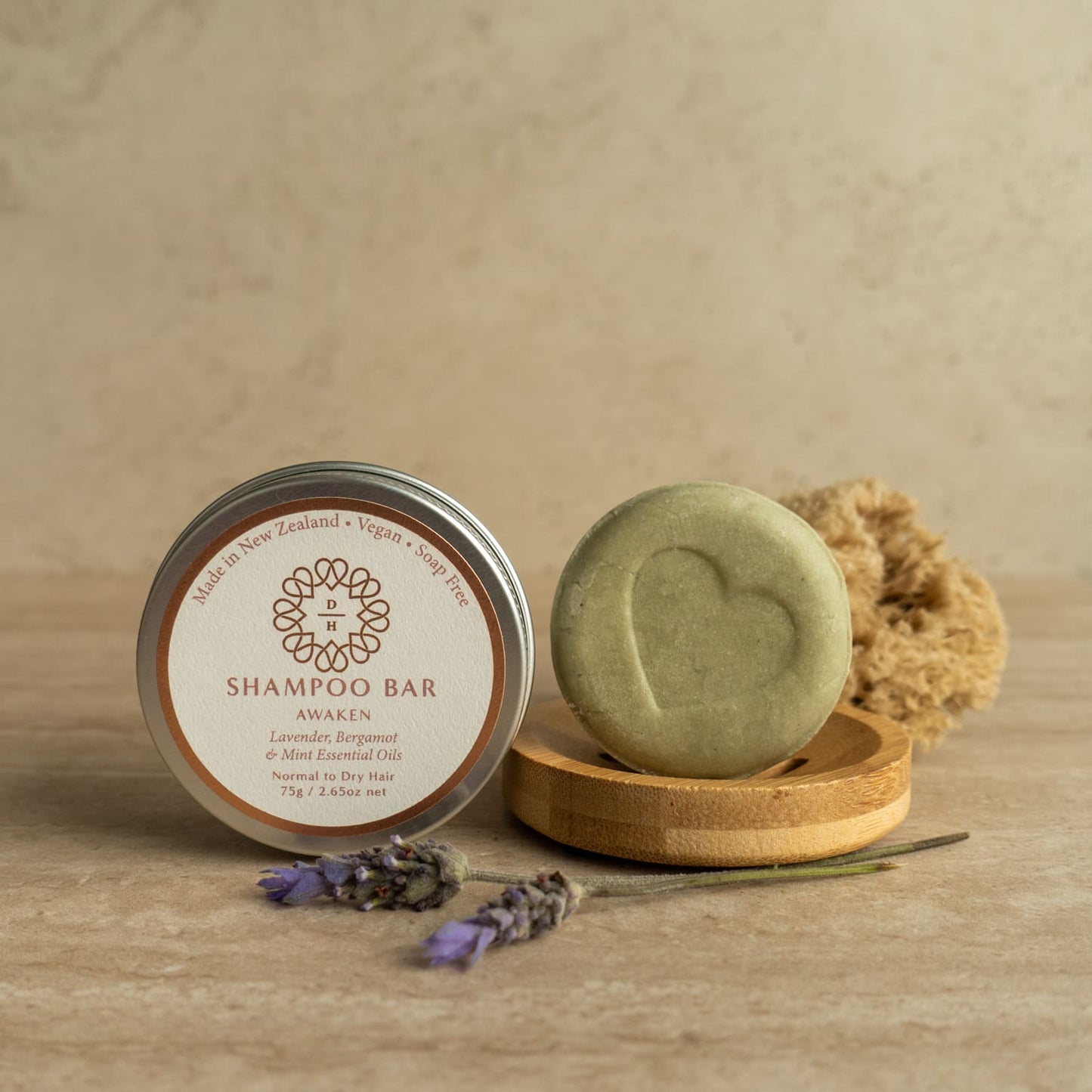 solid shampoo bar awaken type with essential oils in a travel tin