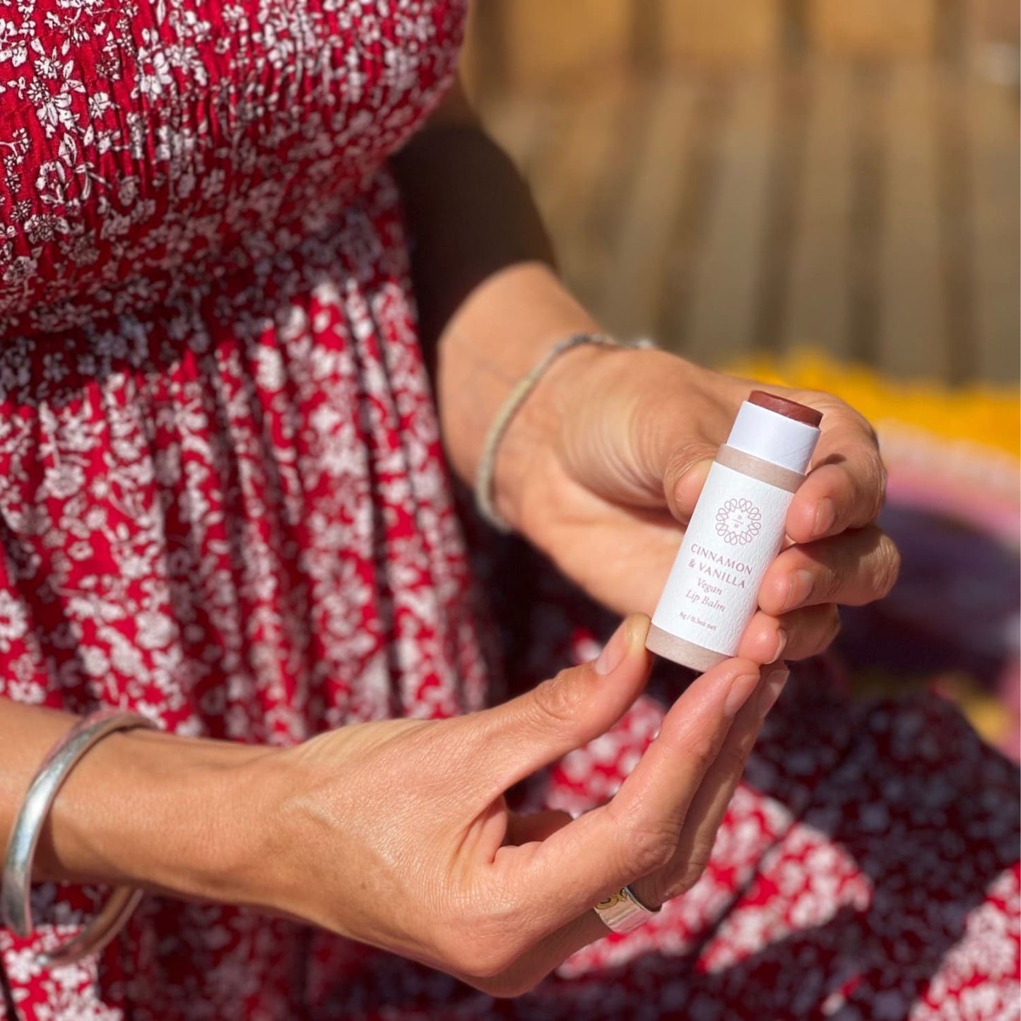 nz lip balm cinnamon and vanilla with red clay tinted in a compostable tube lid off