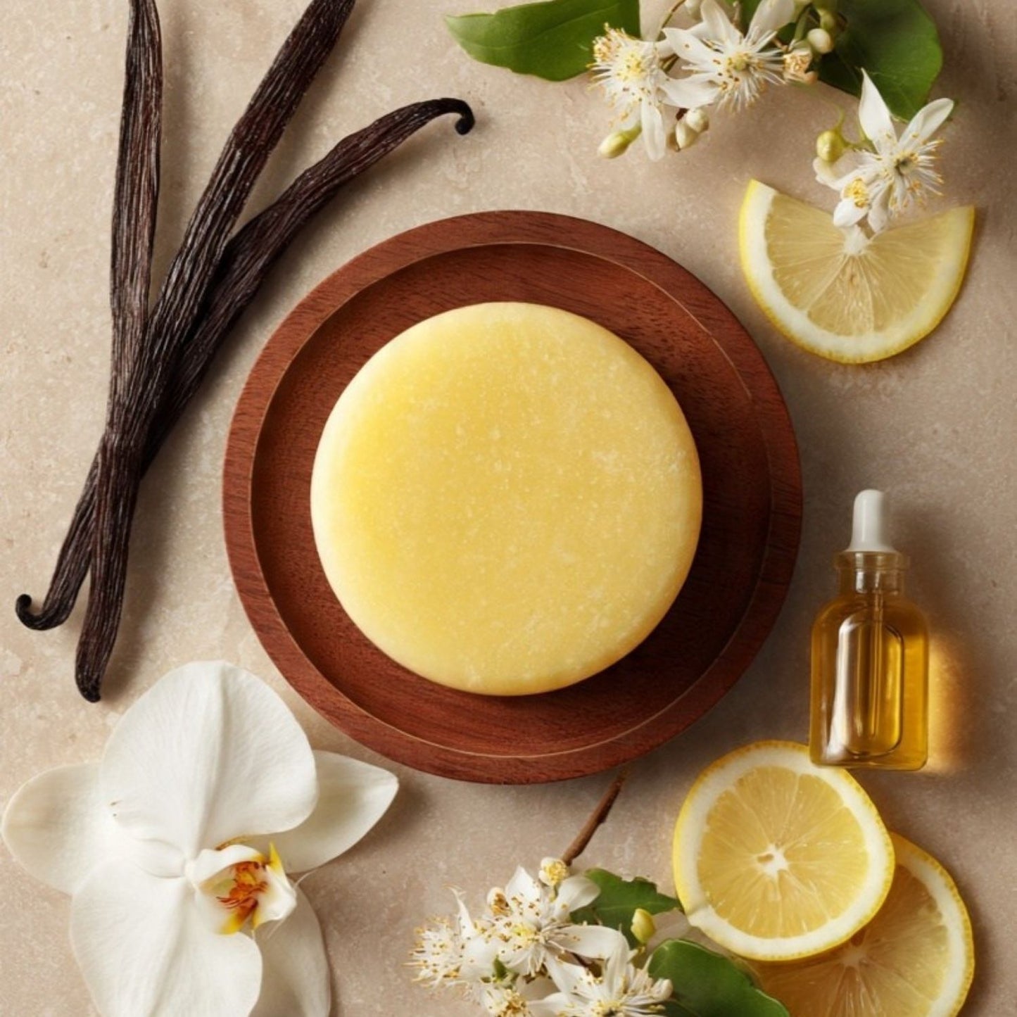 solid conditioner bar without the tin surrounded by lemons argan oil vanilla pods and lemon myrtle flowers made in nz