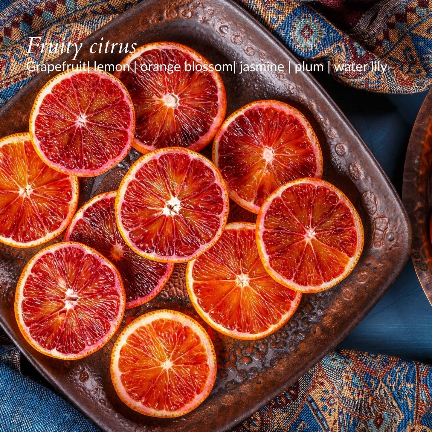 close up slices of blood orange soy candle by dear heart nz