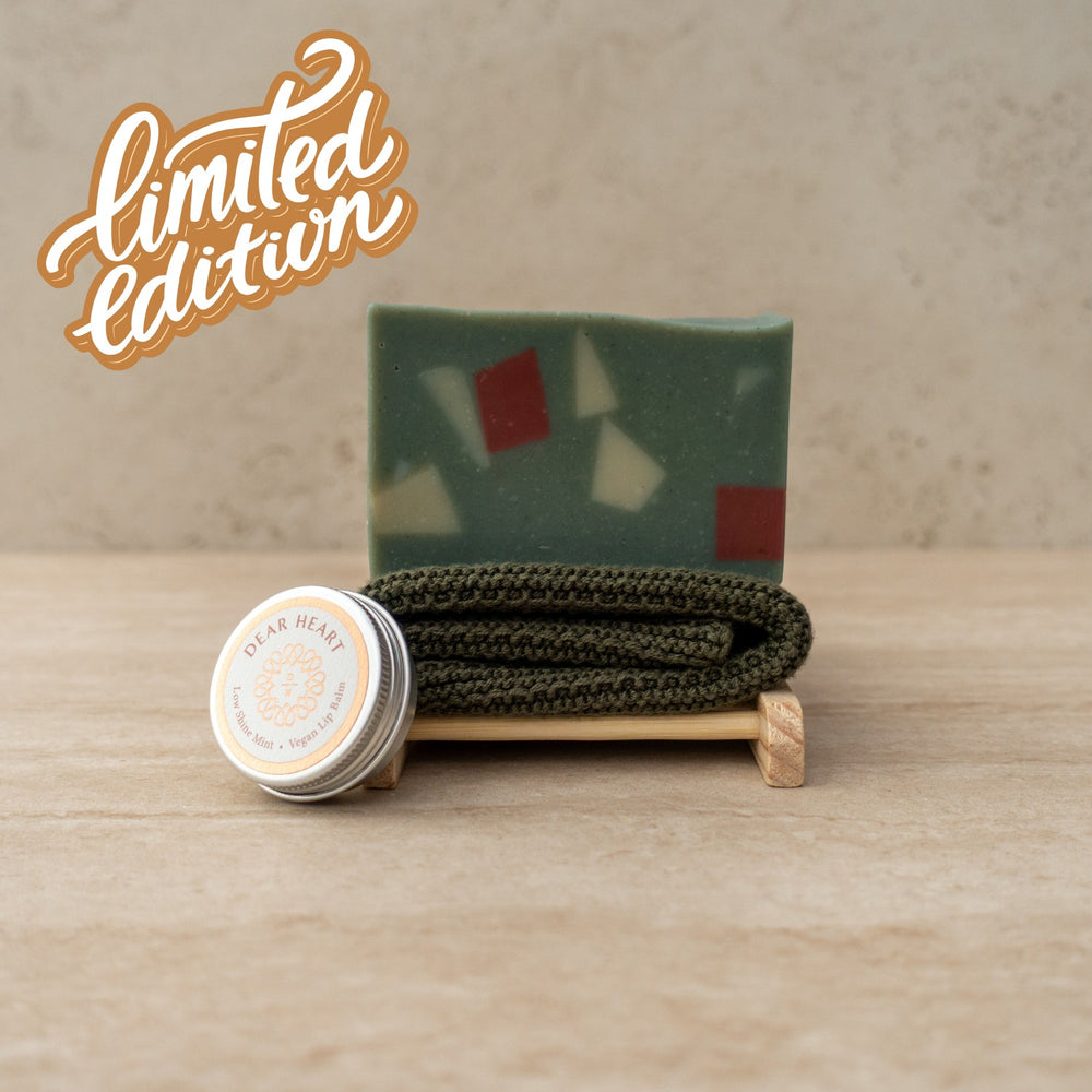 Our christmas gift boxes contain a large bar of handmade soap, wooden soap rack, organic cotton wash cloth and mint lip balm