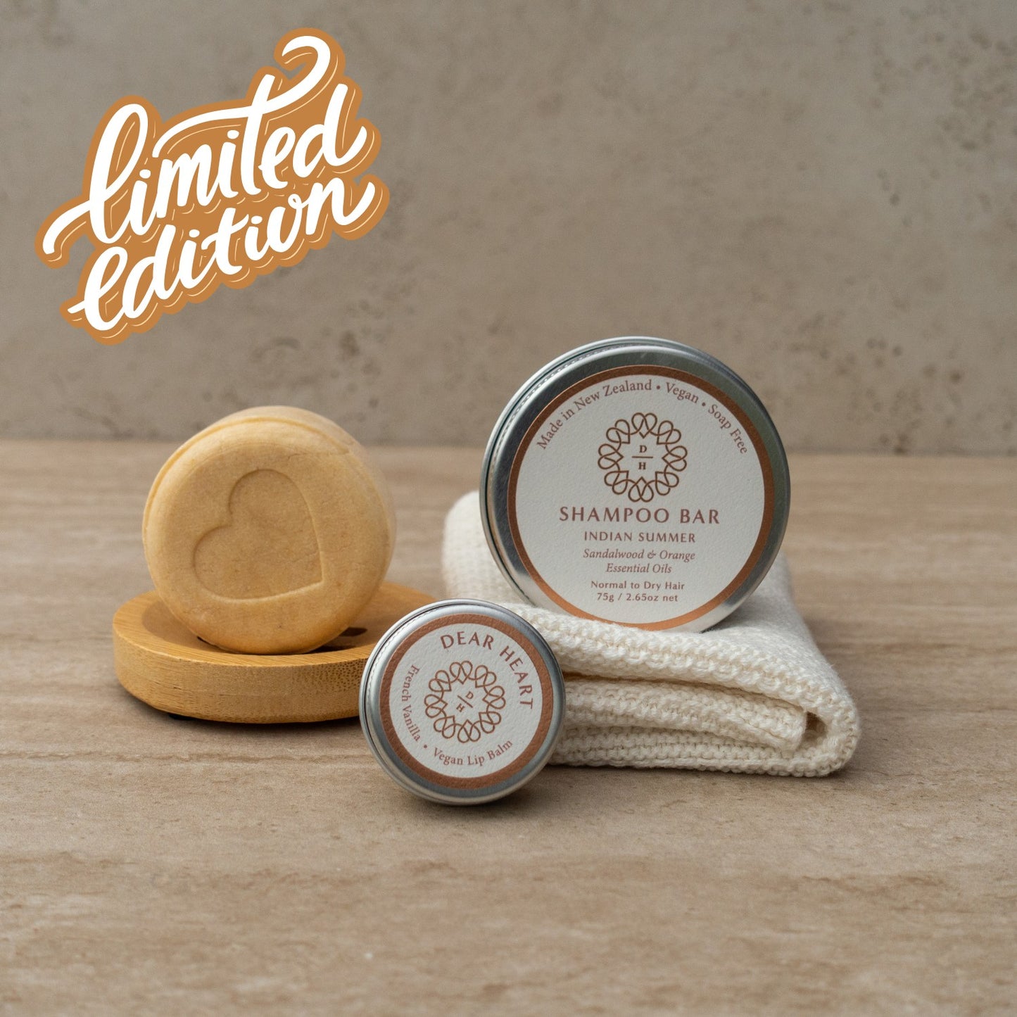 luxury gift box with indian summer shampoo bar 75g, vanilla lip balm, bamboo bar holder and one organic cotton wash cloth all in a box