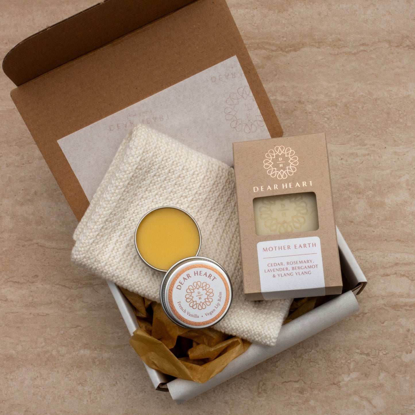 mother earth gift box containing boxed soap handmade vanilla lip balm in eco friendly tin and thick cotton washcloth in marshmallow