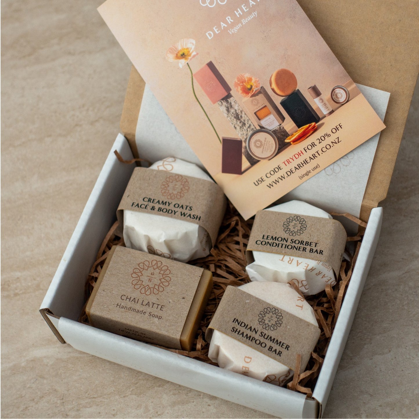 cute gift boxes containing creamy oats face and body wash shampoo bar conditioner bar and chai latte handmade soap made in nz