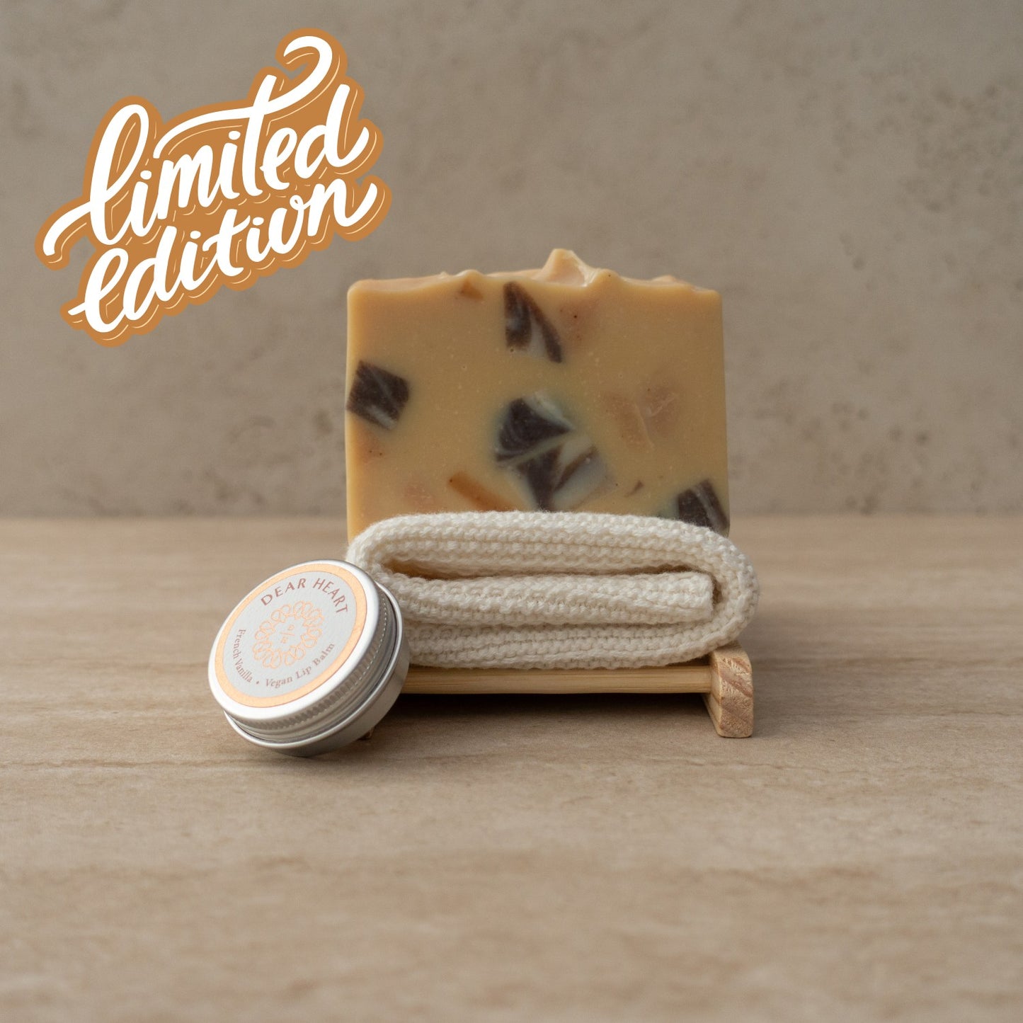 thoughtful vegan gift boxes with large size cinnamon and clove fragranced soap bar, organic cotton washcloth and vanilla lip balm in a round tin.